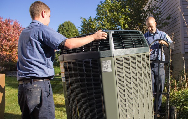 Fire & Ice service technician performing maintenance on an air conditioner